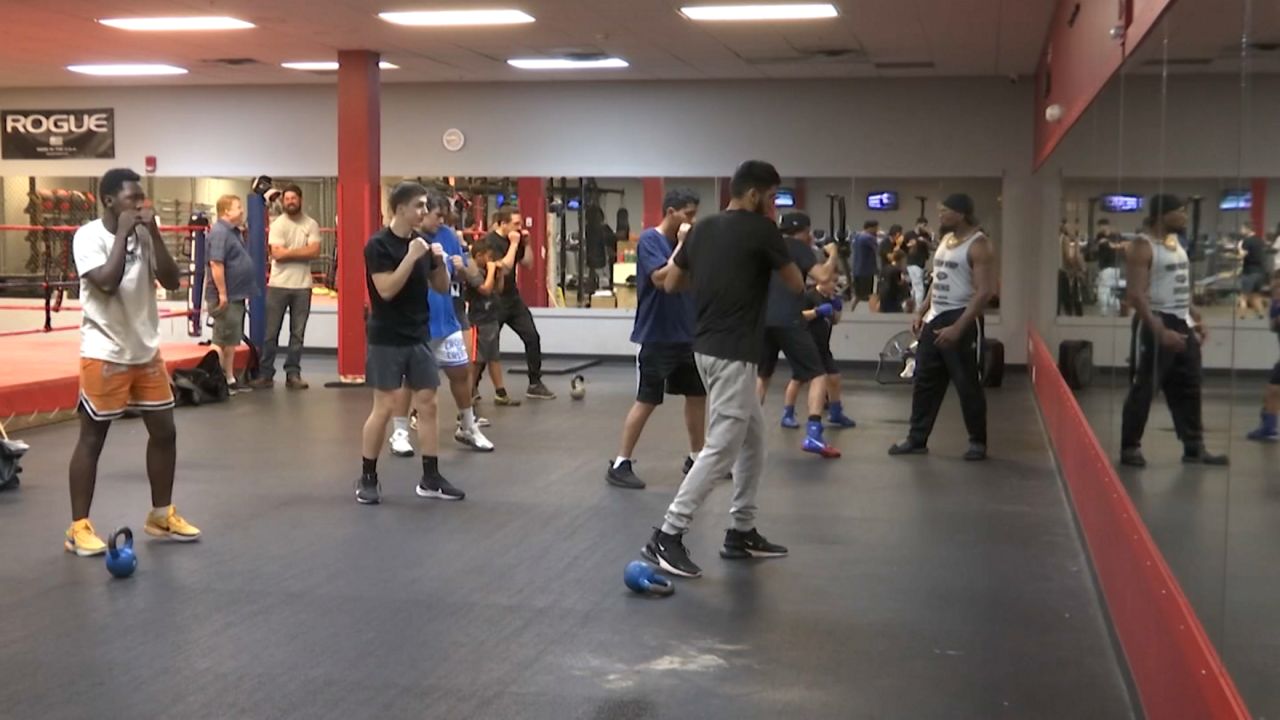 Free boxing camp at World Gym inspires community with champion's guidance