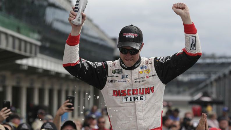 NASCAR Cup Series driver Brad Keselowski (2) celebrates after winning the NASCAR Brickyard 400 auto race at Indianapolis Motor Speedway, in Indianapolis Monday, Sept. 10, 2018. (AP Photo/Michael Conroy)