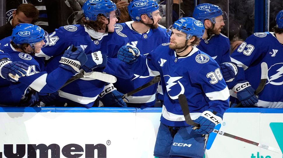 Tampa Bay Lightning left wing Brandon Hagel (38) celebrates with the bench after scoring against the Los Angeles Kings during the third period of an NHL hockey game Thursday, Jan. 30, 2025, in Tampa, Fla. (AP Photo/Chris O'Meara)