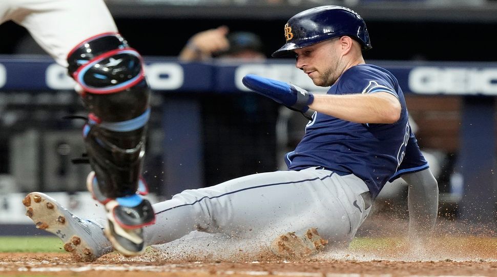 Tampa Bay Rays' Brandon Lowe scores on a single hit by Amed Rosario during the fifth inning of a baseball game against the Miami Marlins, Tuesday, June 4, 2024, in Miami. (AP Photo/Lynne Sladky)