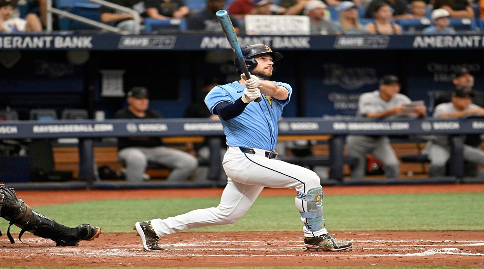 Tampa Bay Rays second base Brandon Lowe hits a two-run home run against the Arizona Diamondbacks during the third inning of a baseball game Sunday, Aug. 18, 2024, in St. Petersburg, Fla. (AP Photo/Jason Behnken)