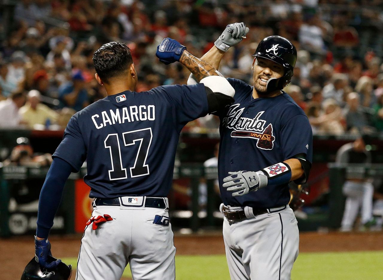 Nick Markakis of the Atlanta Braves heads to the dugout during the