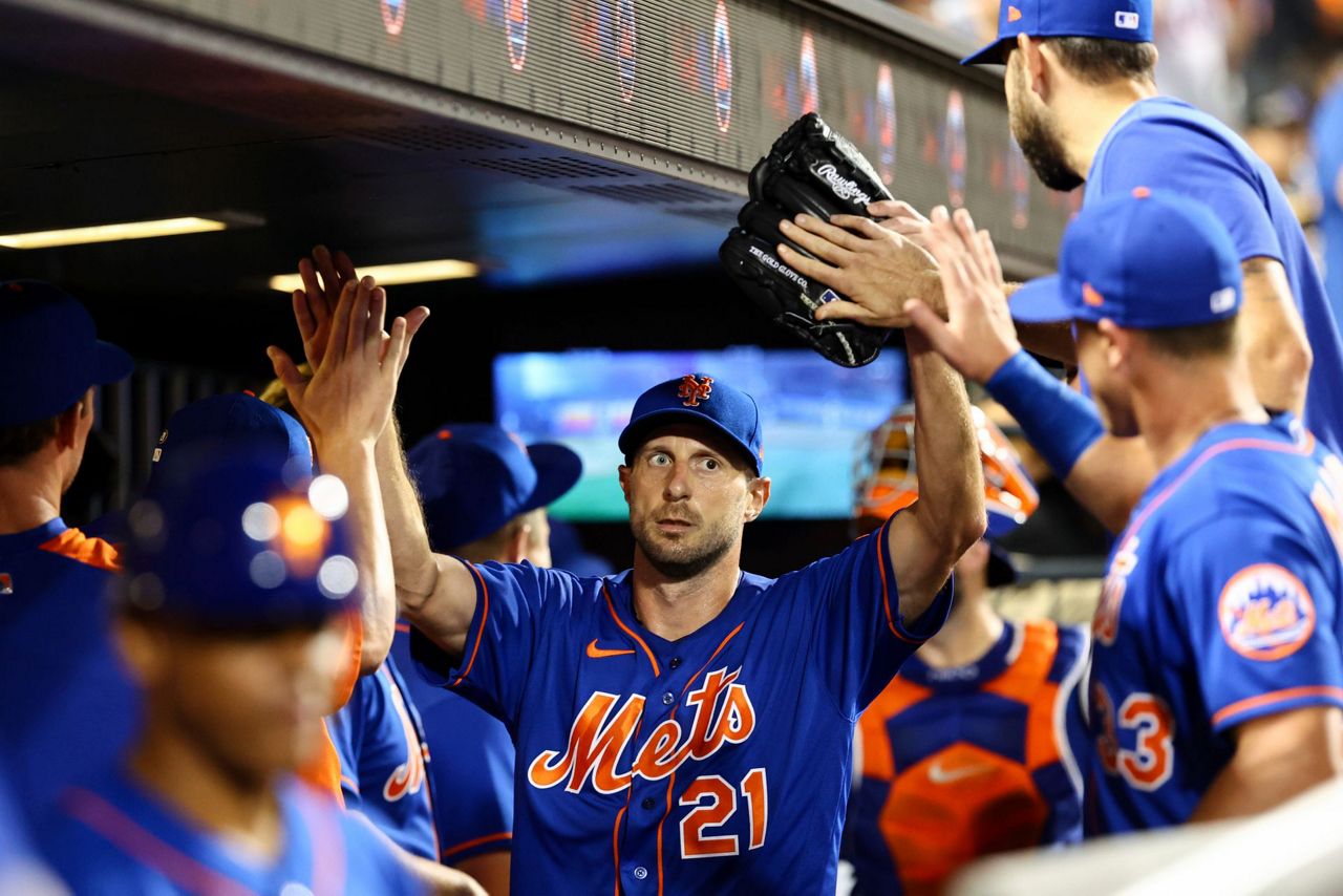 Marcell Ozuna celebrates milestone with teammates . and