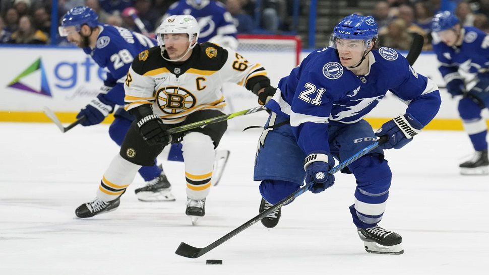 Tampa Bay center Brayden Point breaks out ahead of Boston forward Brad Marchand on Thursday night.