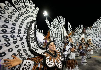 Rio carnival is BACK! Brazil's famous dancers look as flamboyant as ever as  parade returns