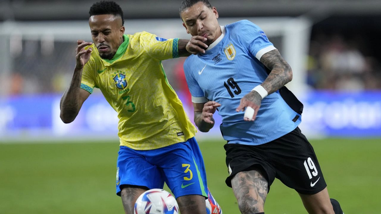 Brazil's Eder Militao, left, and Uruguay's Darwin Nunez fight for the ball during a Copa America quarterfinal soccer match in Las Vegas, Saturday, July 6, 2024. (AP Photo/Godofredo A. Vásquez)