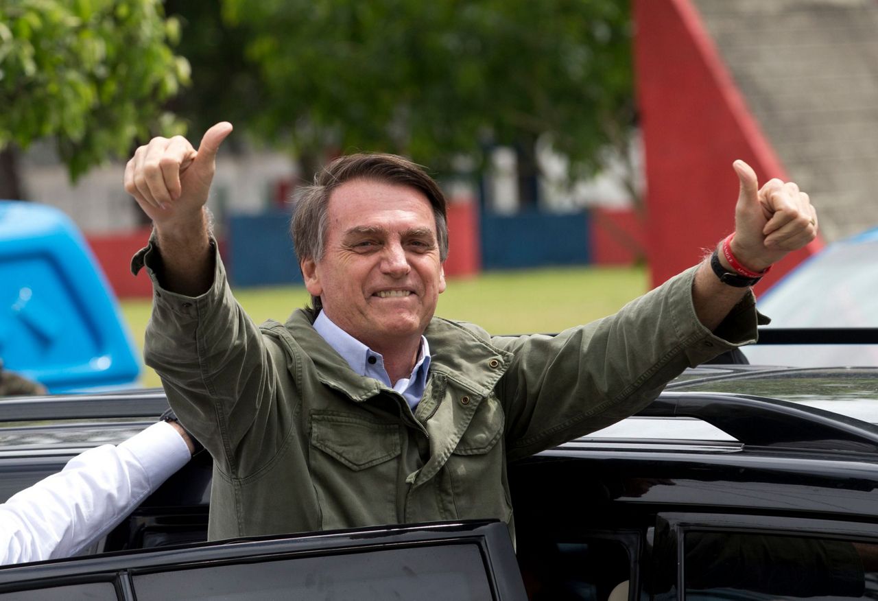 The Latest: Brazilians begin voting for next president
