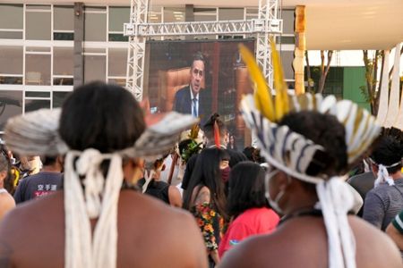 Indigenous people march for land rights in Brazil ahead of court ruling