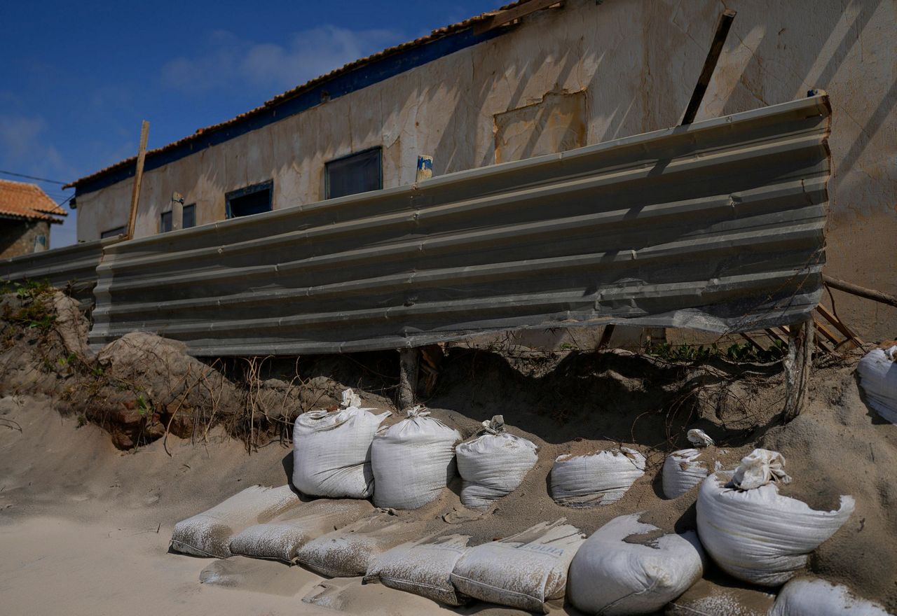 Brazil city district slipping into sea after river diverted
