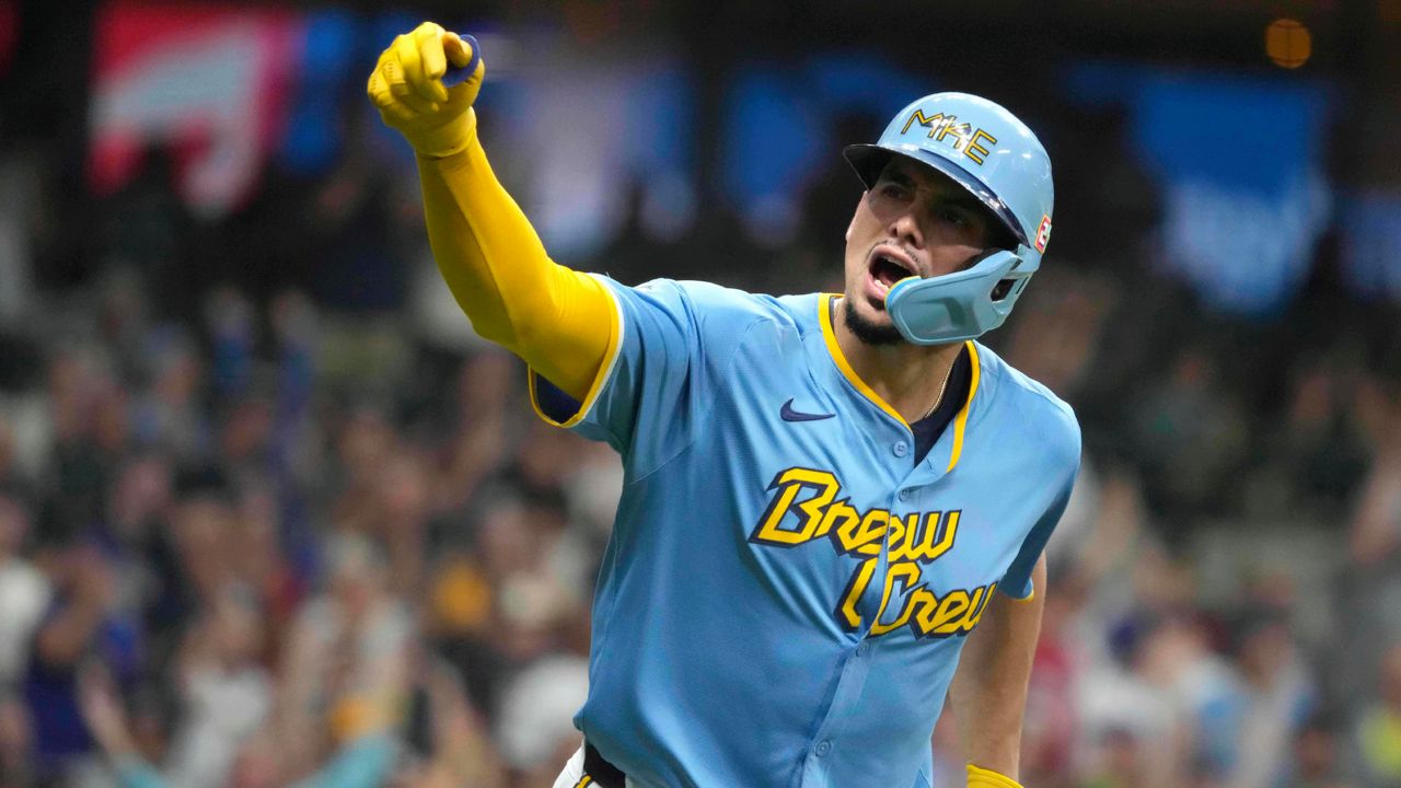 Milwaukee Brewers' Willy Adames (27) reacts to hitting a three-run home run during the first inning of a baseball game against the Cleveland Guardians, Friday, Aug. 16, 2024, in Milwaukee.