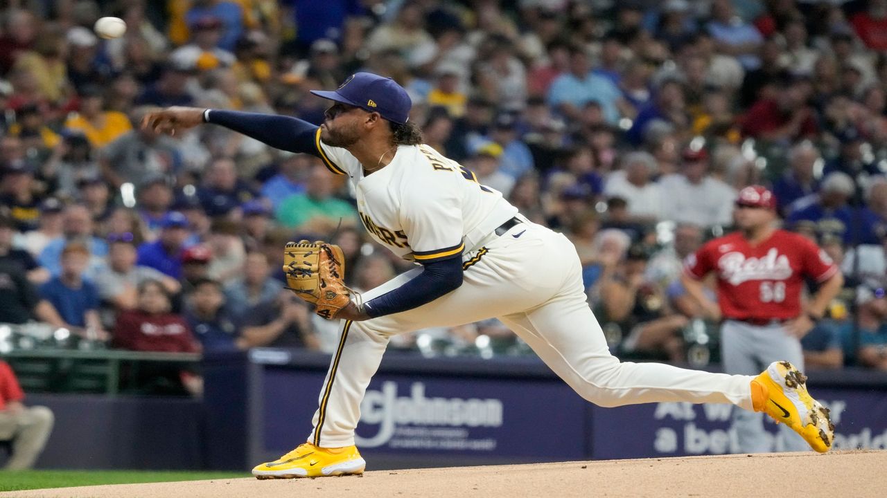 Peralta matches career high with 13 Ks, Brewers beat Reds