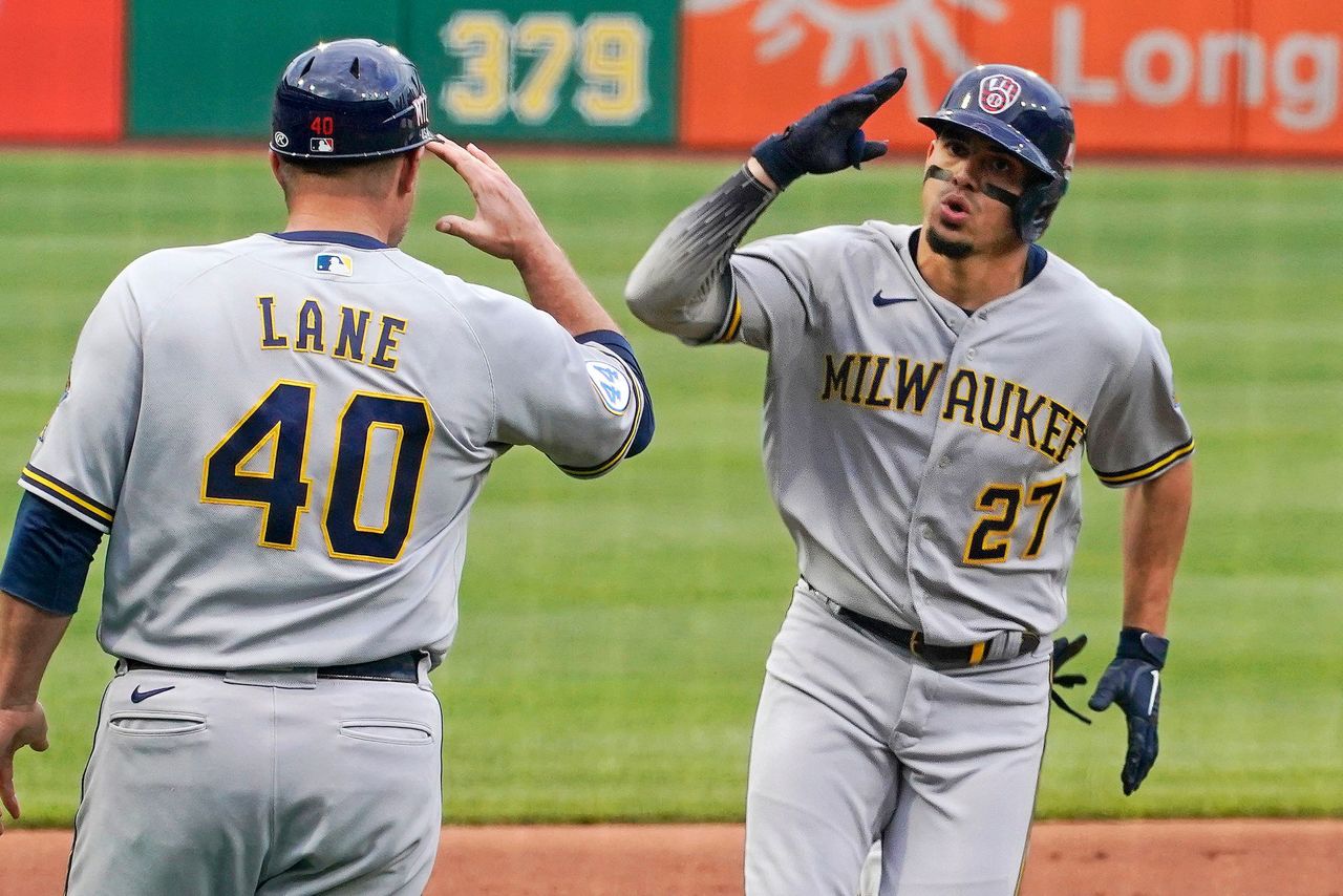 Brewers SS Willy Adames leaves game after getting hit by foul ball while in  dugout