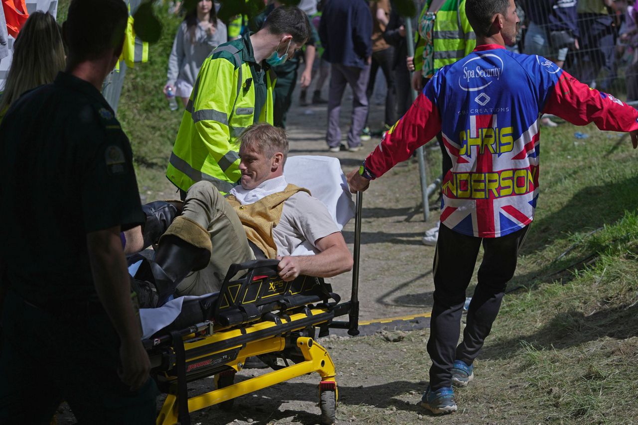Rolling thunder: Contestants chase cheese wheel down a hill in chaotic ...
