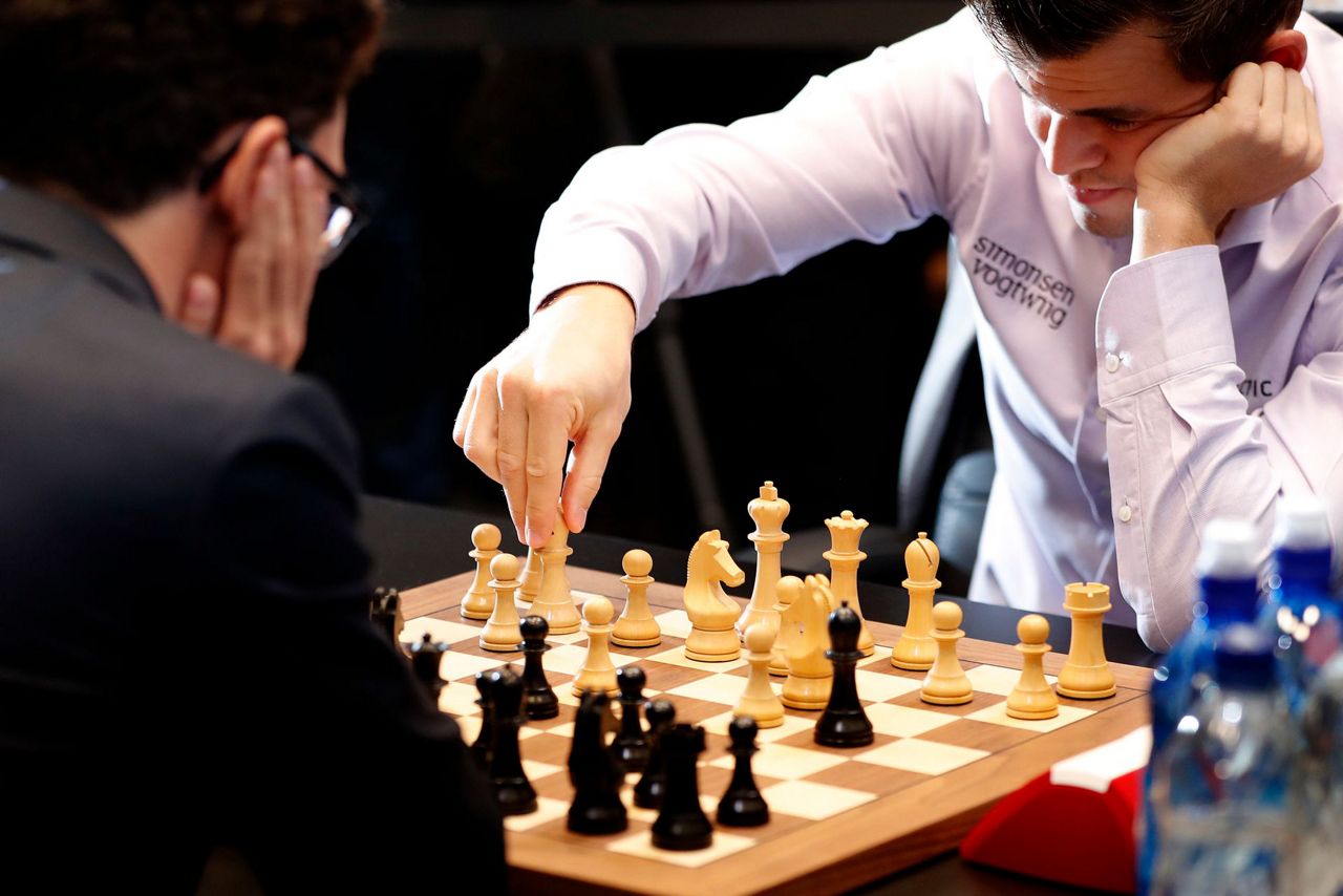 Norway's Carlsen beats Caruana to defend chess world title