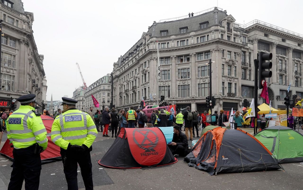 UK police arrest more than 100 in climate change protests