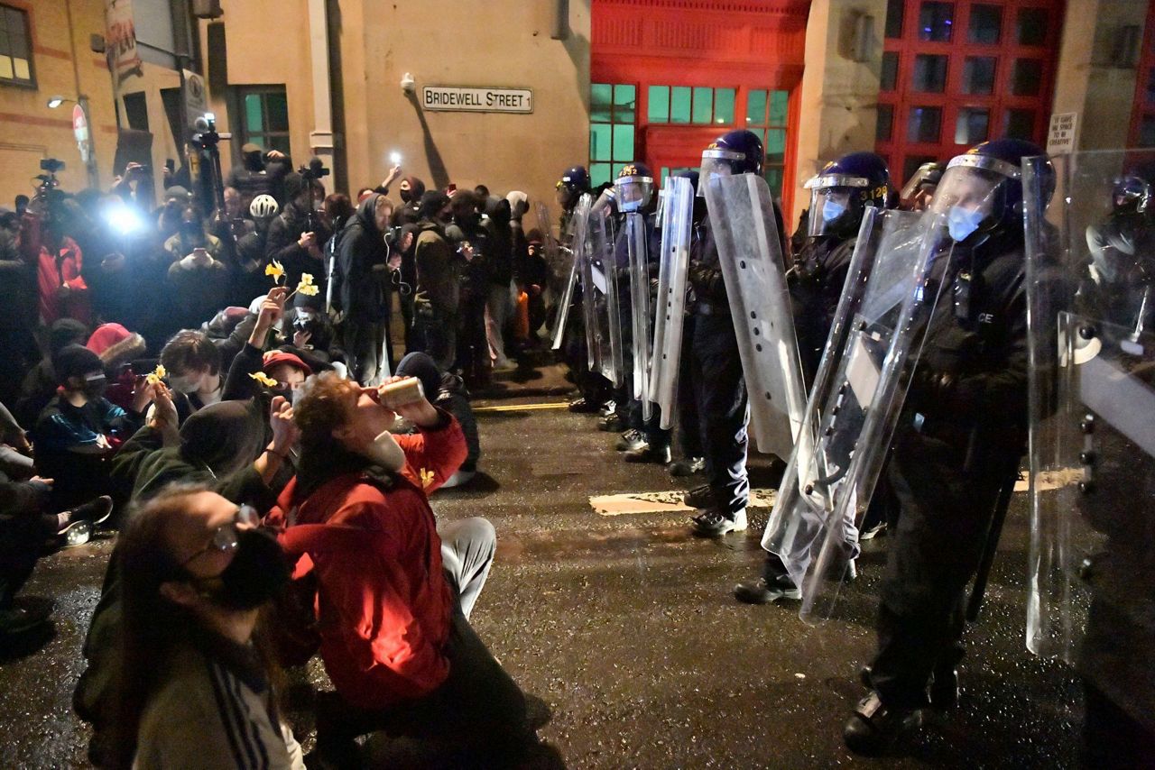 UK protesters scuffle with police during rally over new law