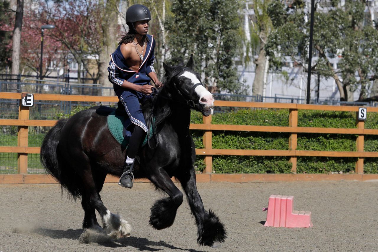 AP PHOTOS: London riding club inspires children to saddle up