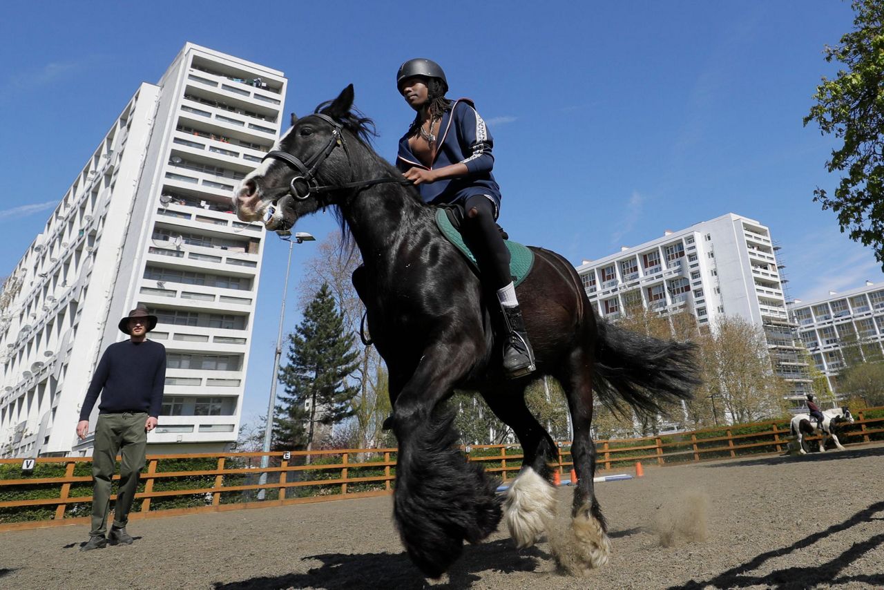 AP PHOTOS: London riding club inspires children to saddle up