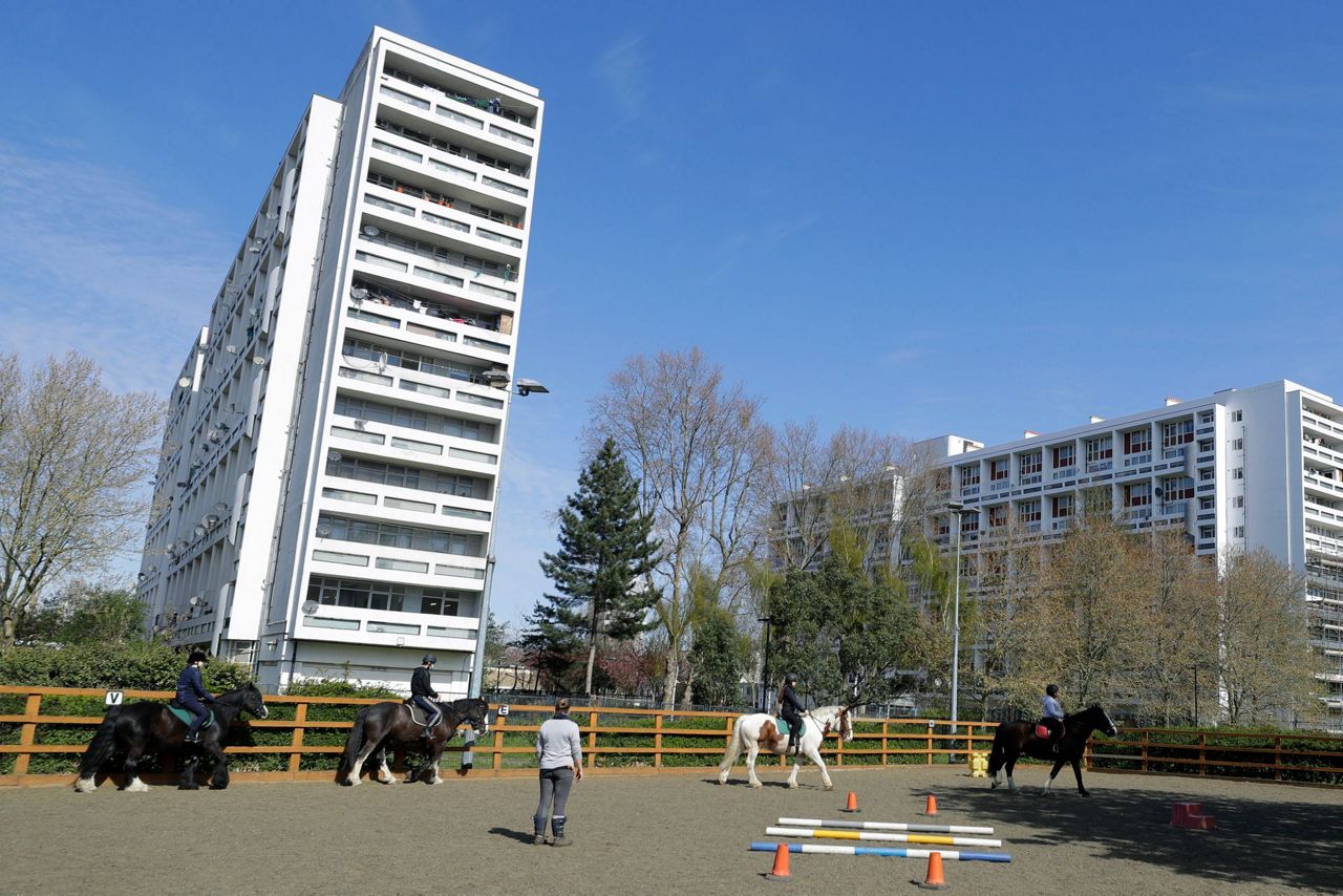 AP PHOTOS: London riding club inspires children to saddle up