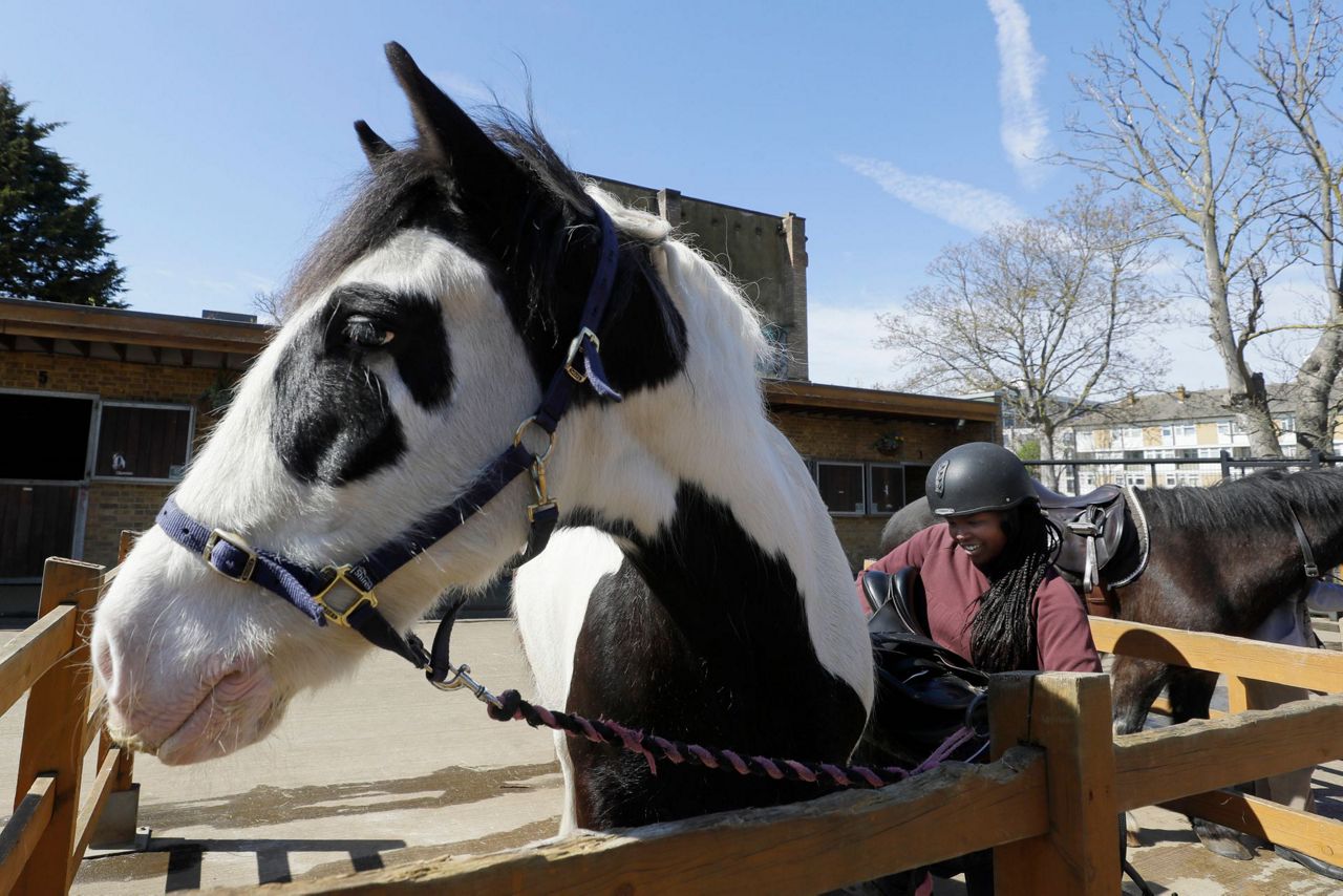 AP PHOTOS: London riding club inspires children to saddle up