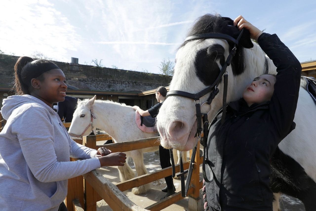 AP PHOTOS: London riding club inspires children to saddle up