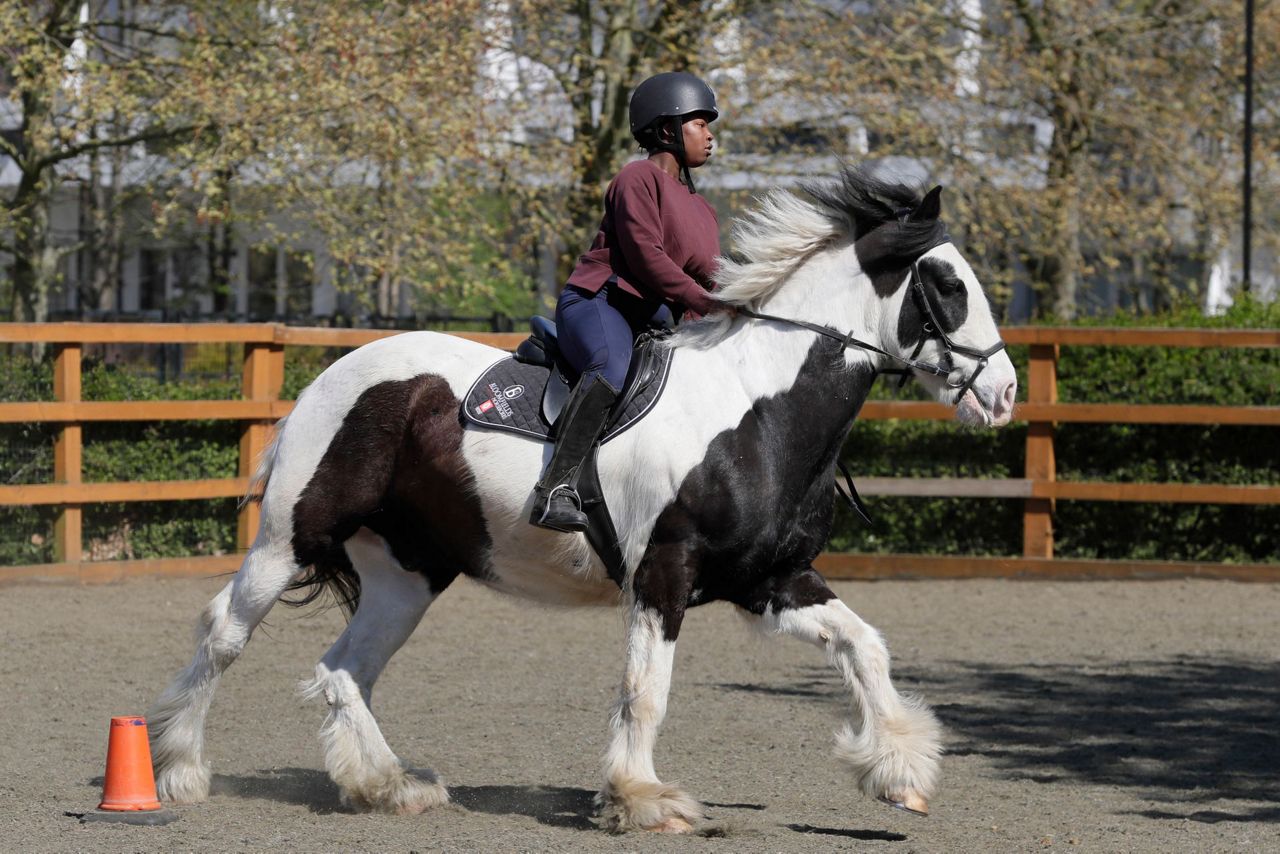 AP PHOTOS: London riding club inspires children to saddle up