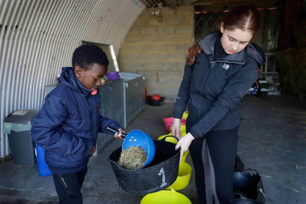 AP PHOTOS: London riding club inspires children to saddle up