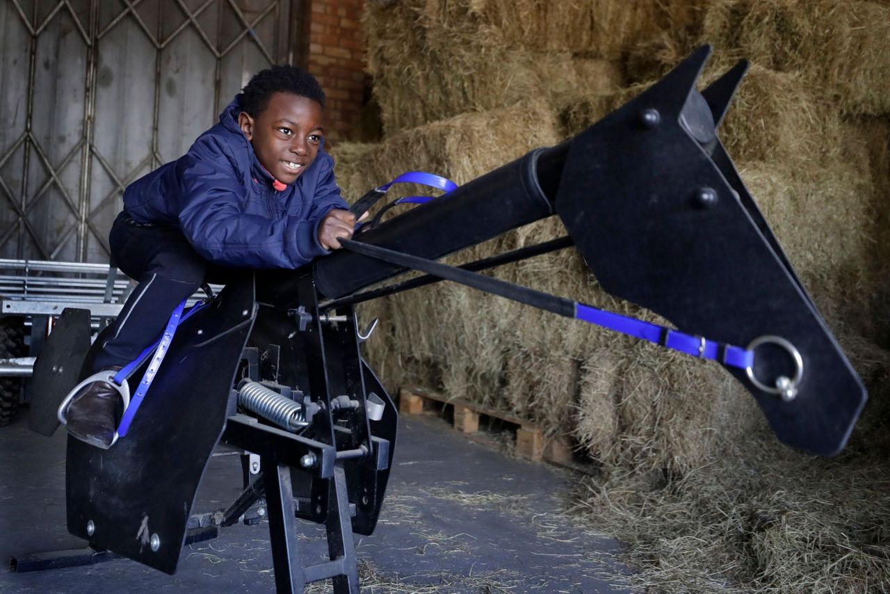 AP PHOTOS: London riding club inspires children to saddle up