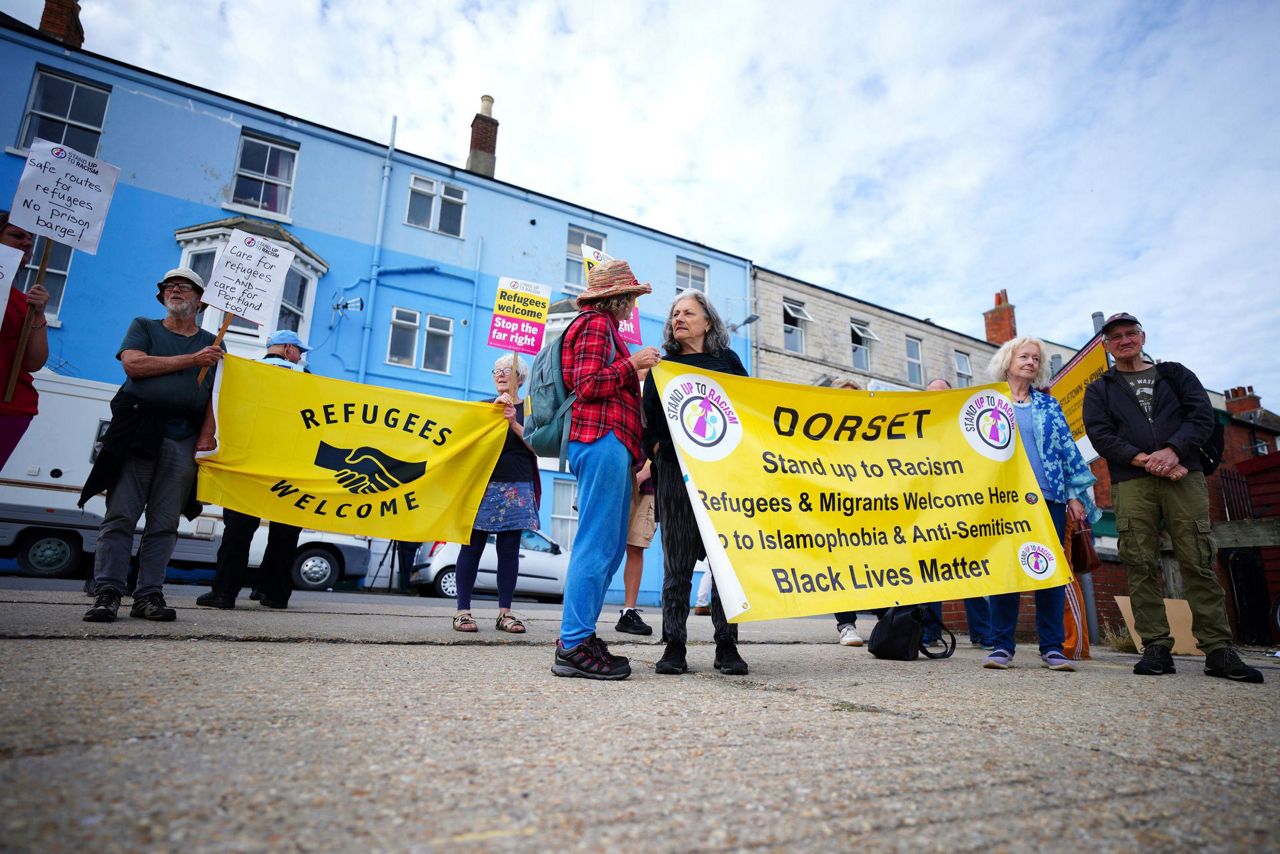 Barge To House Asylum-seekers Arrives In UK As Parliament Passes ...