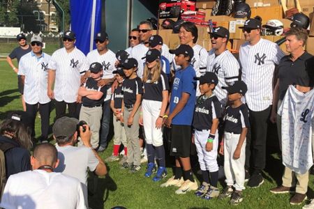 Former professional baseball player Hideki Matsui teaches children