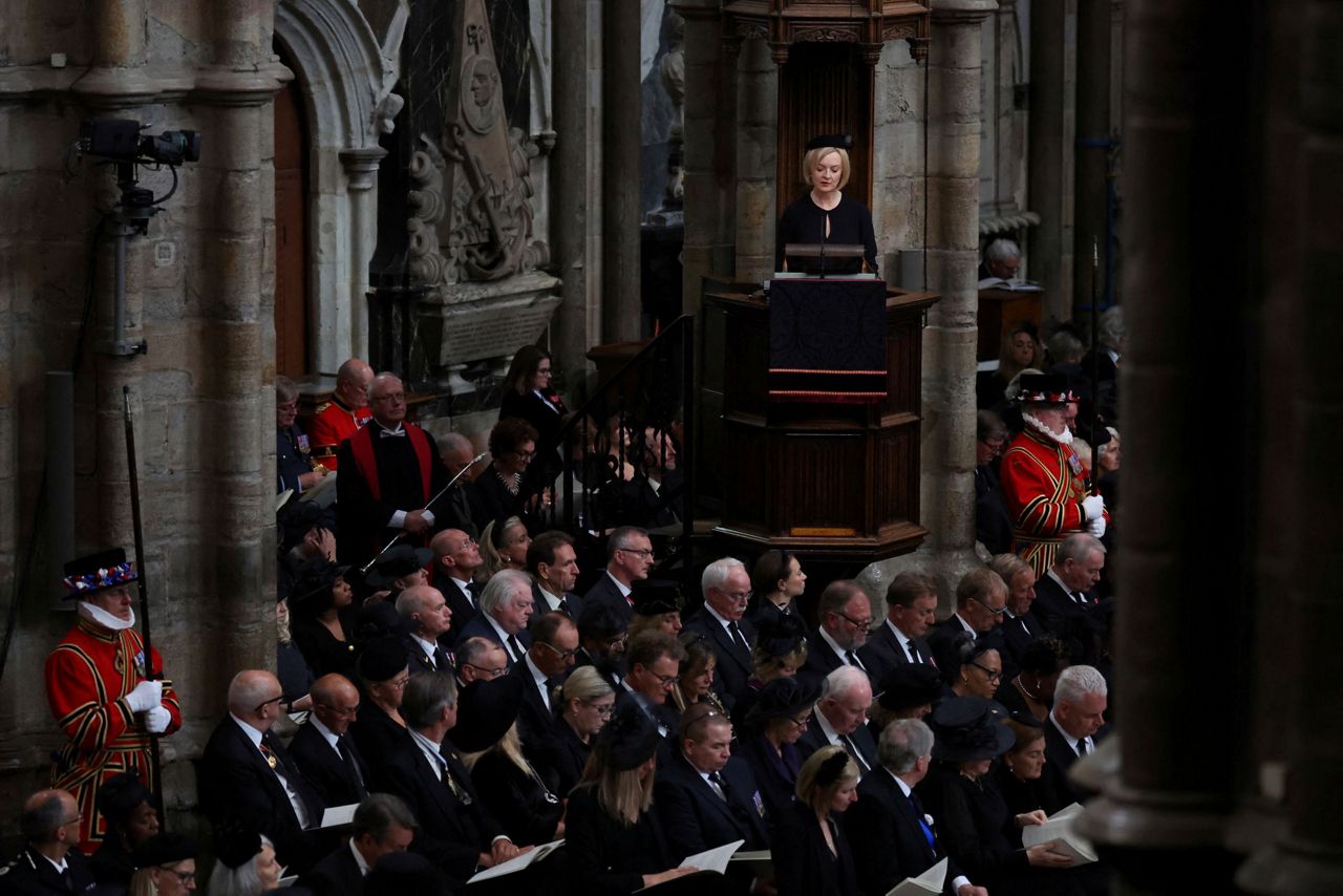 2 of 5. British Prime Minister Liz Truss speaks at the Westminster Abbey du...