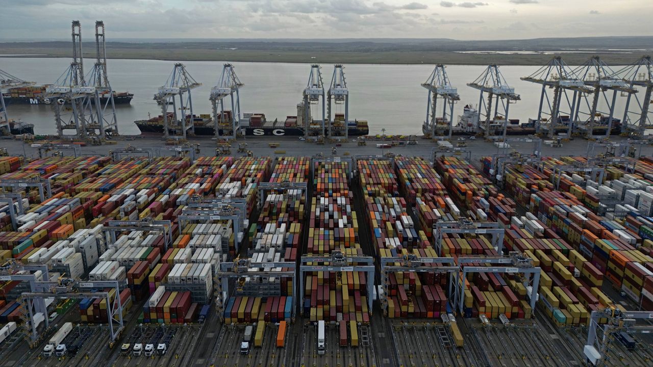 Shipping containers wait to be processed at London Gateway port, in Stanford-le-Hope, on the Thames estuary east of London, England, Wednesday, Feb. 5, 2025. (AP Photo, File)