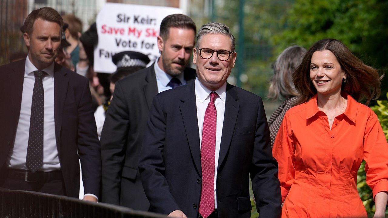 Labour Party leader Keir Starmer and wife Victoria arrive at a polling station to cast their vote in London, Thursday, July 4, 2024. (AP Photo/Vadim Ghirda)