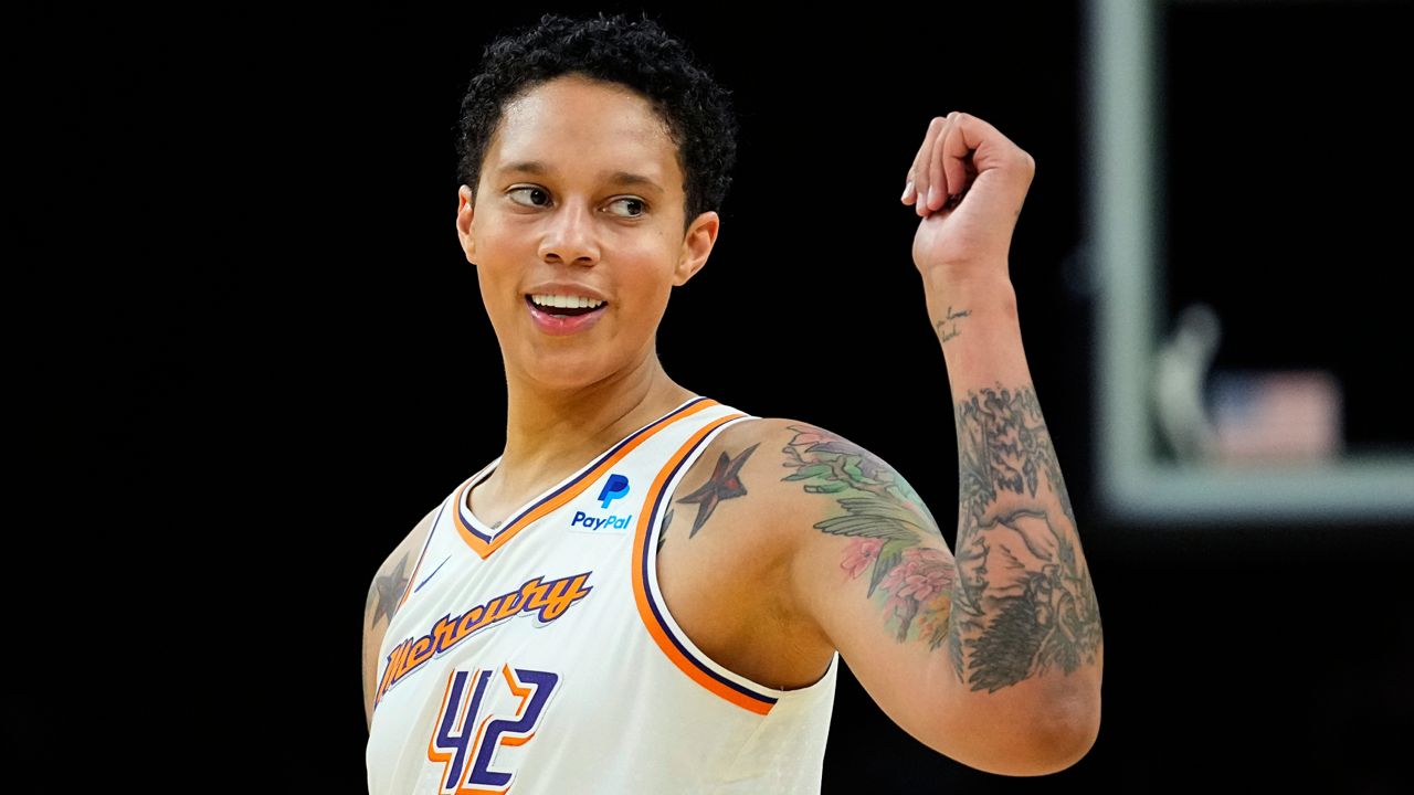 Phoenix Mercury center Brittney Griner smiles during the first half of a WNBA preseason basketball game against the Los Angeles Sparks, Friday, May 12, 2023, in Phoenix. (AP Photo/Matt York)