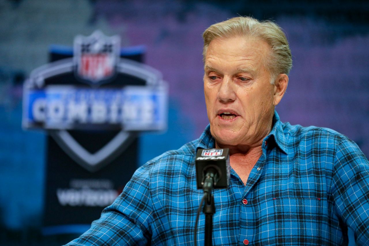 Draft room felt like locker room for Denver Broncos executive Elway