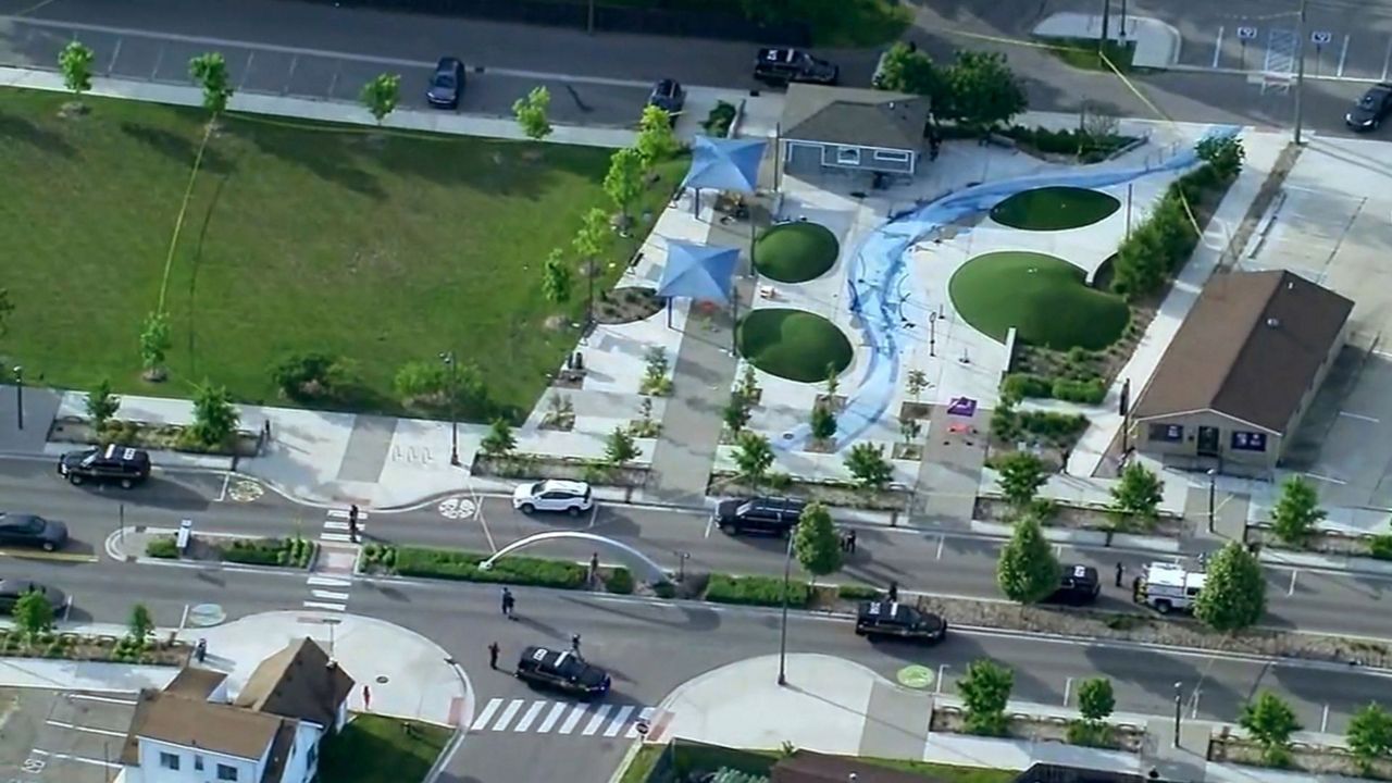 Police respond to the scene of a shooting at the Brooklands Plaza Splash Pad, Saturday, June 15, 2024, in Rochester Hills, Mich. The Oakland County Sheriff’s Office says there are “numerous wounded victims” after police were called for an active shooter. (WXYZ via AP)