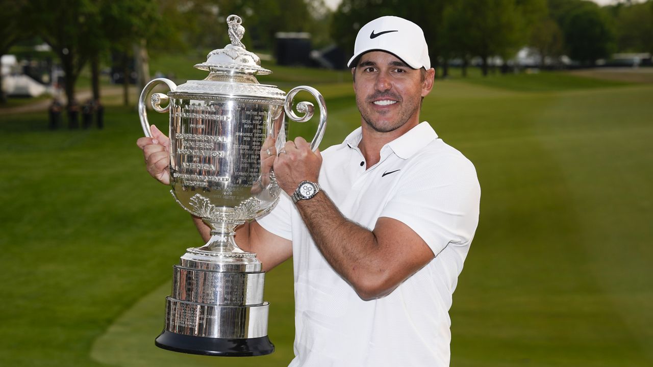 Brooks Koepka holds the Wanamaker trophy after winning the PGA Championship golf tournament at Oak Hill Country Club on Sunday, May 21, 2023, in Pittsford, N.Y. (AP Photo/Seth Wenig)