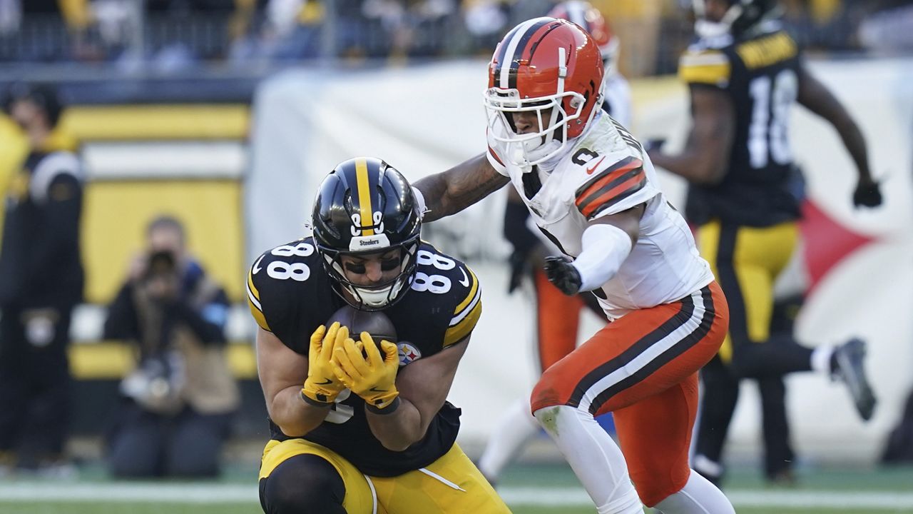 Pittsburgh Steelers tight end Pat Freiermuth (88) catches a pass in front of Cleveland Browns cornerback Greg Newsome II (0) in the second half of an NFL football game in Pittsburgh, Sunday, Dec. 8, 2024. (AP Photo/Matt Freed)