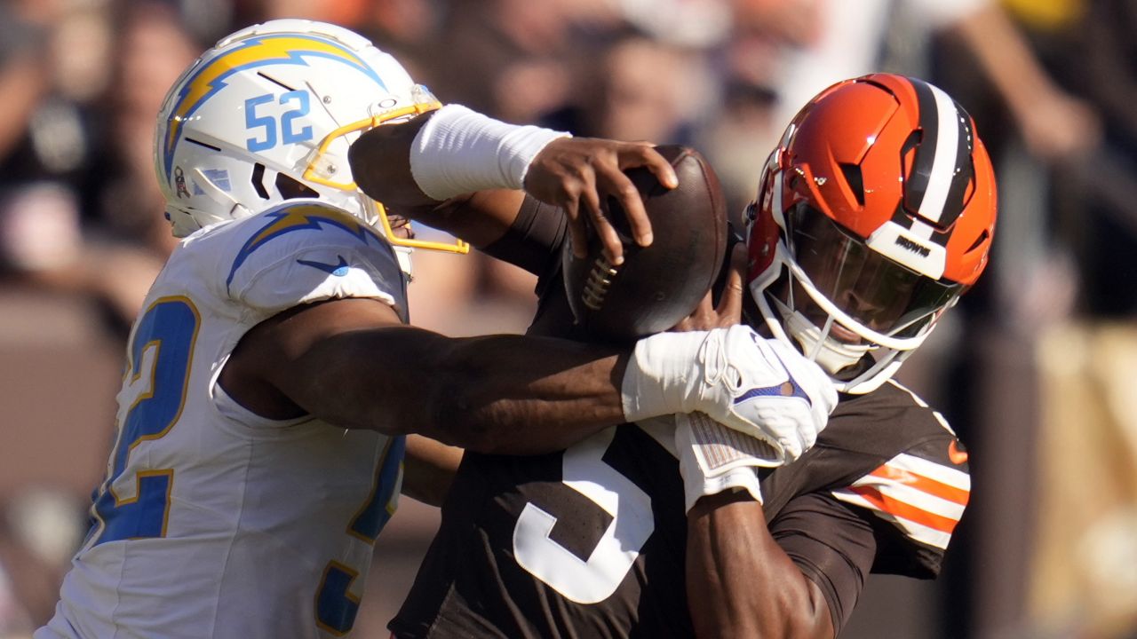 Los Angeles Chargers linebacker Khalil Mack (52) sacks Cleveland Browns quarterback Jameis Winston (5) for a 6-yard loss in the first half of an NFL football game Sunday, Nov. 3, 2024, in Cleveland. (AP Photo/Sue Ogrocki)