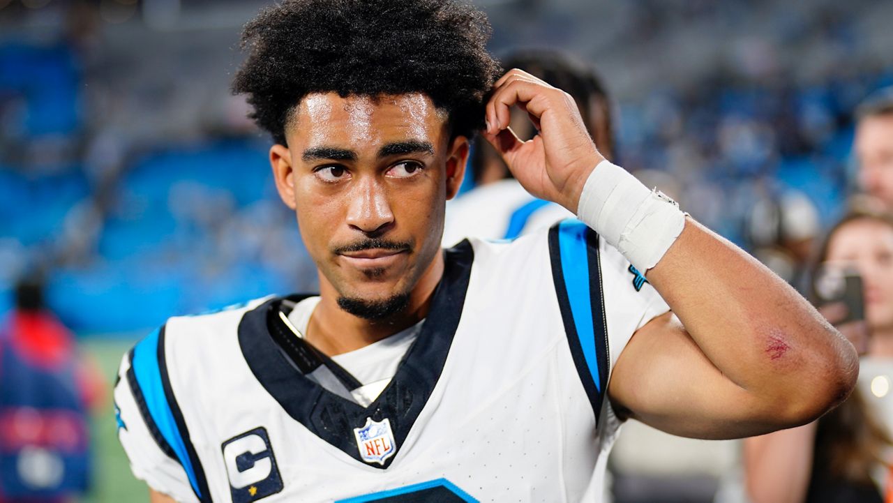 Carolina Panthers quarterback Bryce Young leaves the field after their loss against the New Orleans Saints in an NFL football game Monday, Sept. 18, 2023, in Charlotte, N.C. (AP Photo/Jacob Kupferman)