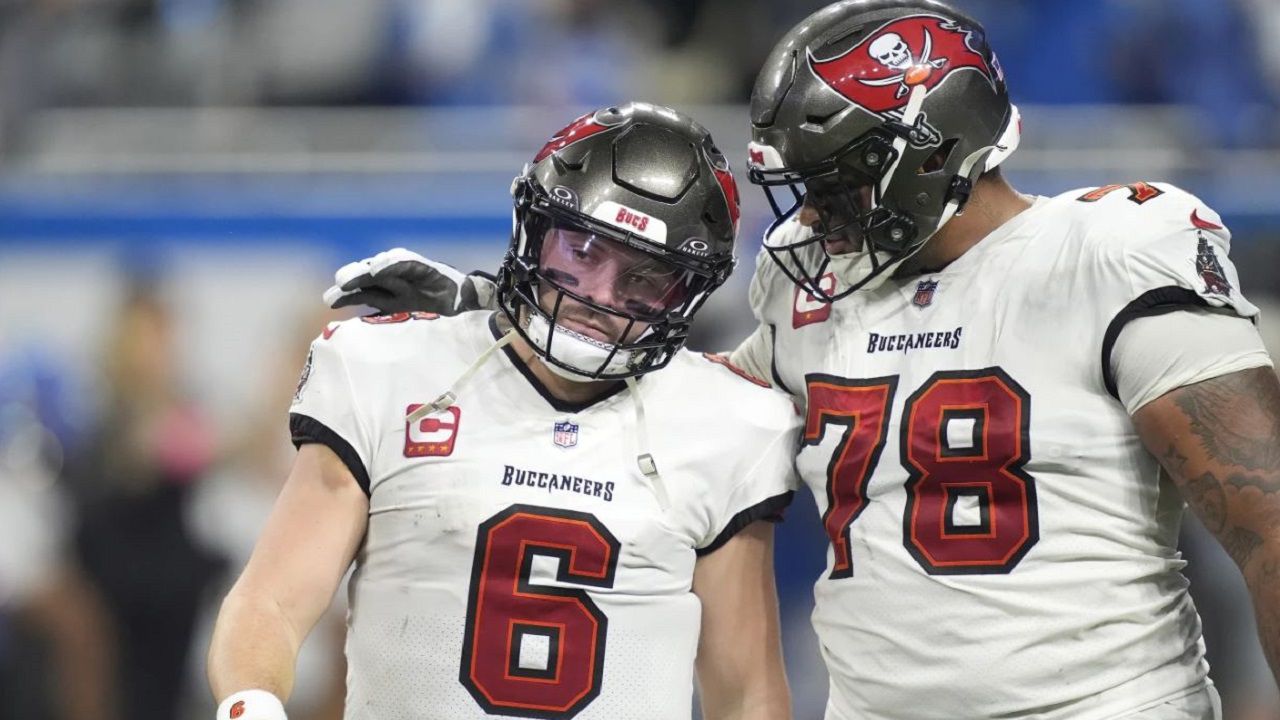 Tampa Bay quarterback Baker Mayfield (6) and offensive lineman Tristan Wirfs (78) walk to the sideline after a Mayfield interception during the second half of the Lions 31-23 NFC divisional playoff game Sunday in Detroit. (AP Photo/Carlos Osorio)