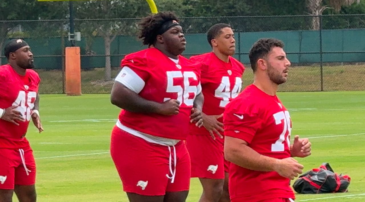 Desmond Watson (center) is the heaviest player in the history of the NFL. He is working hard to lose weight and says he doesn't want his size to define him. (Spectrum News)