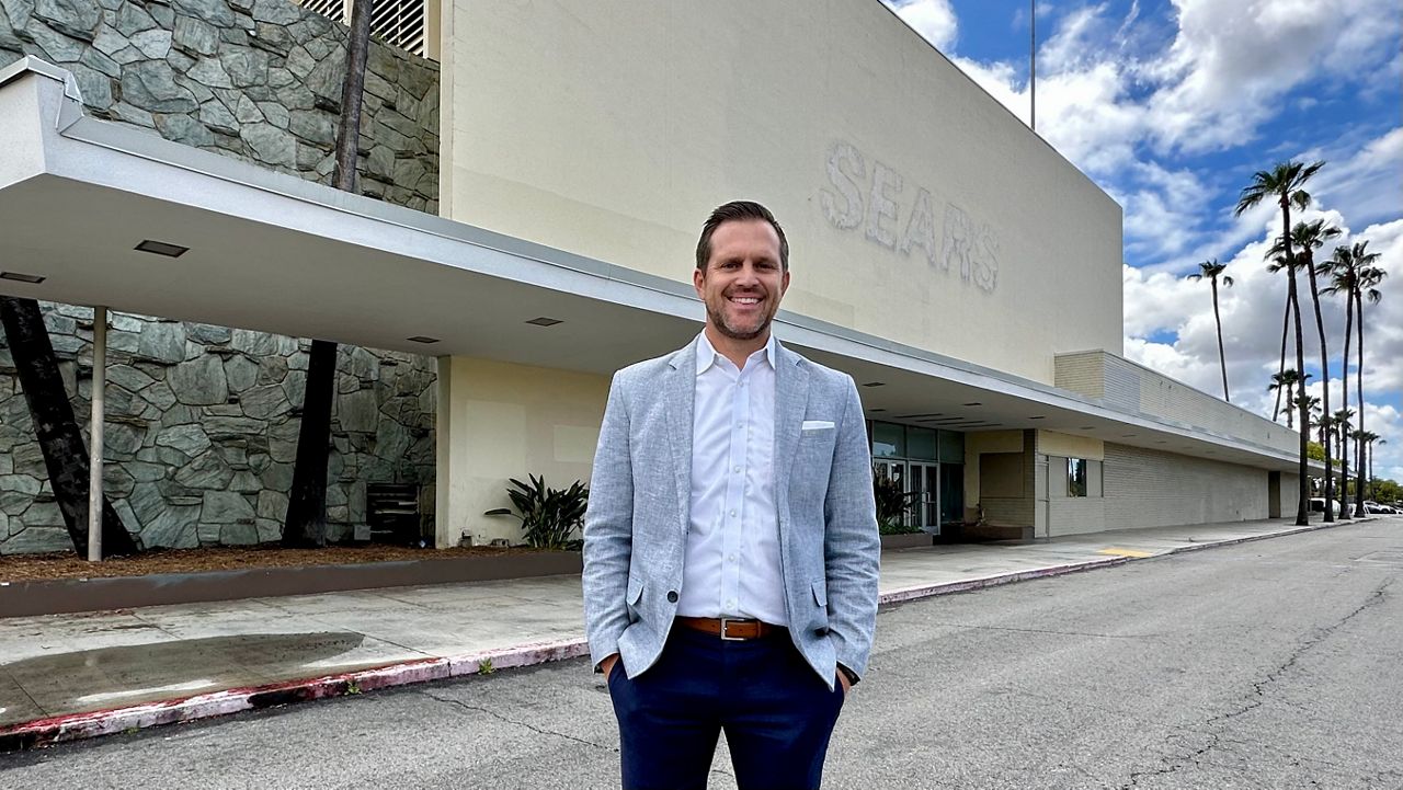 Merlone Geier managing director Jamas Gwilliam stands in front of the former Buena Park Mall Sears. (Spectrum News/Joseph Pimentel)
