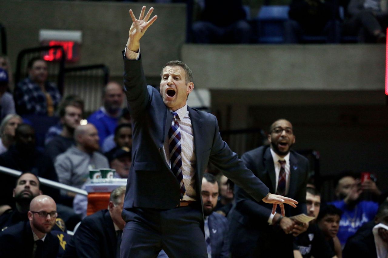 Massinburg scores 43, Buffalo stuns No. 13 WVU 9994 in OT