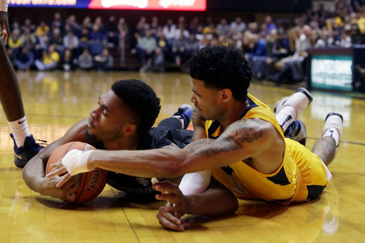 Massinburg scores 43, Buffalo stuns No. 13 WVU 9994 in OT