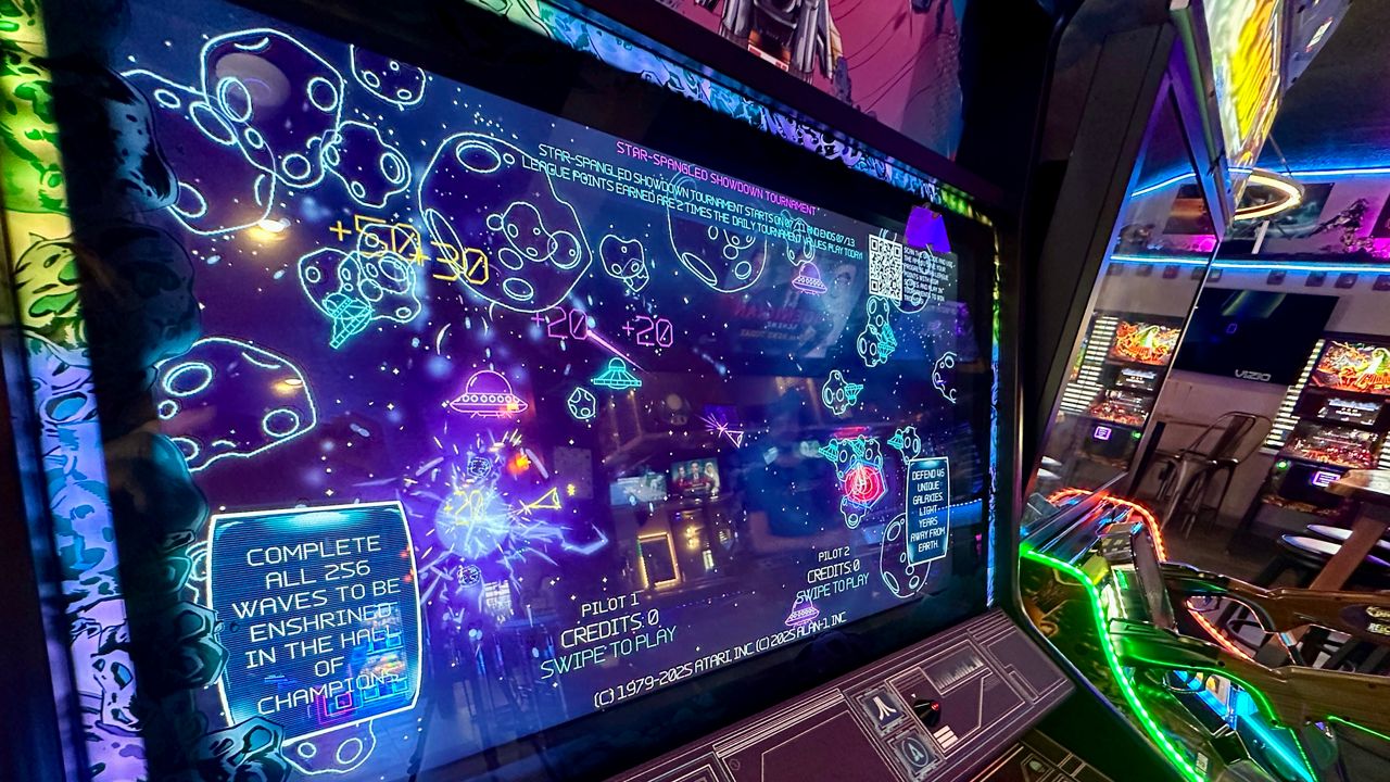 Asteroids online means international play at Reboot Arcade & Bar in Dunedin. Advances to old school games mean pinball machines have television screens. A cacophony of game themes and movie clips await. (Spectrum News/Virginia Johnson)
