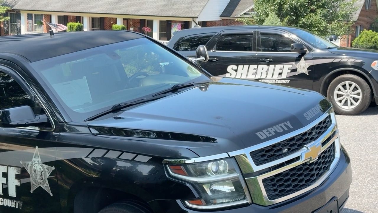 Catawba County Sheriff's Office vehicles parked outside a crime scene