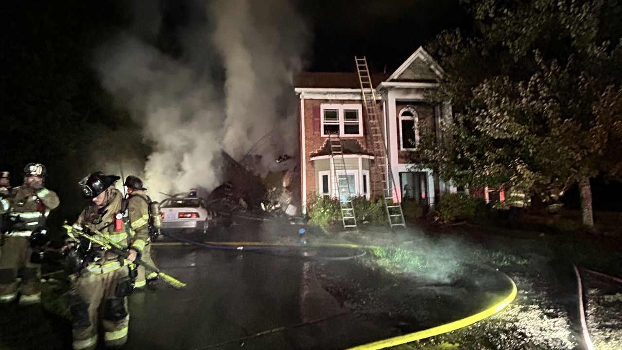 A firefighter was seriously injured after becoming trapped while battling a house fire in Charlotte's Ballantyne area Tuesday morning, according to officials. (Charlotte Fire Department via X)