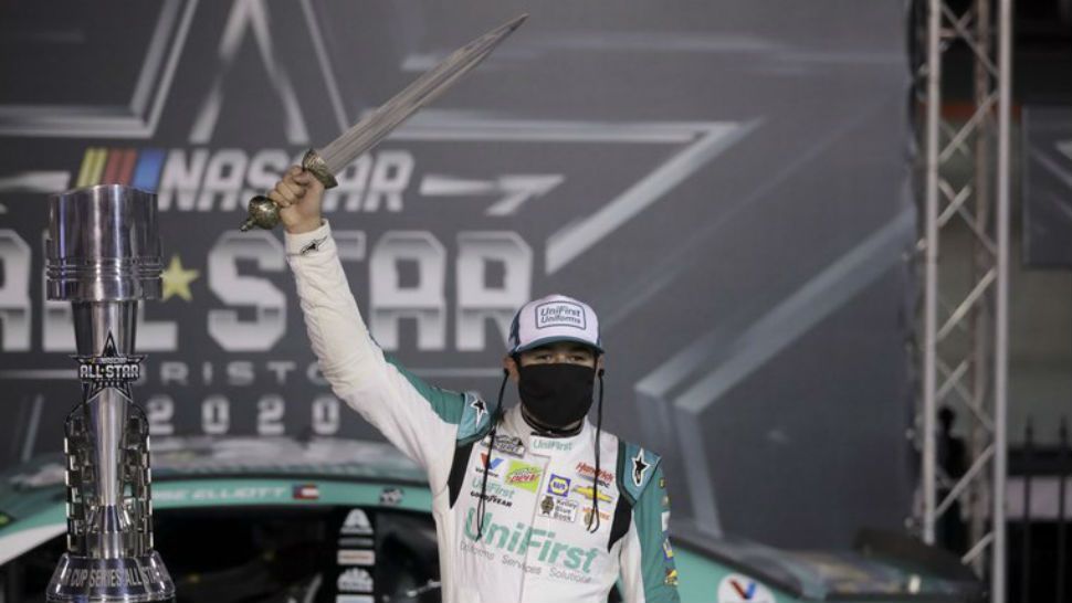 Chase Elliott celebrates with the trophy after winning a NASCAR All-Star auto race at Bristol Motor Speedway in Bristol, Tenn, Wednesday, July 15, 2020. (AP Photo/Mark Humphrey)