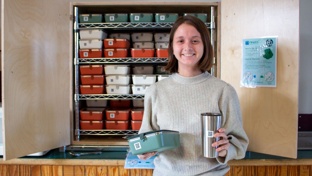 COA student Linnea Goh holds dishware that can be checked out as part of the school’s to-go ware program (College of the Atlantic)